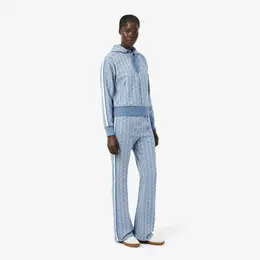 Женские расклешенные спортивные брюки Lacoste с монограммой Женские расклешенные спортивные брюки Lacoste с монограммой