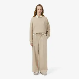 Женские хлопковые спортивные брюки-клёш Lacoste